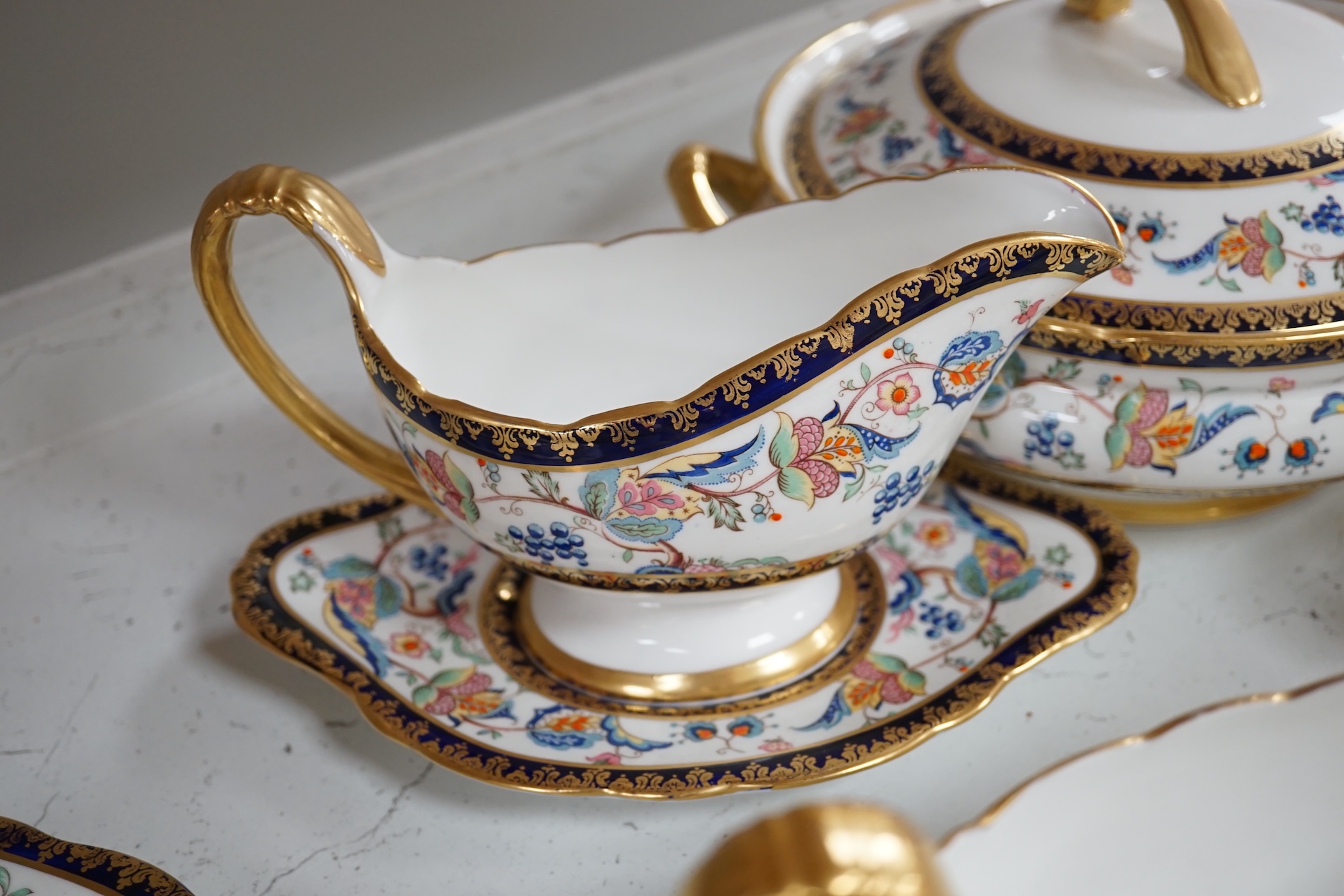 An extensive Paragon bone china dinner service to include tureens, plates and sauce boats. Condition - fair to good